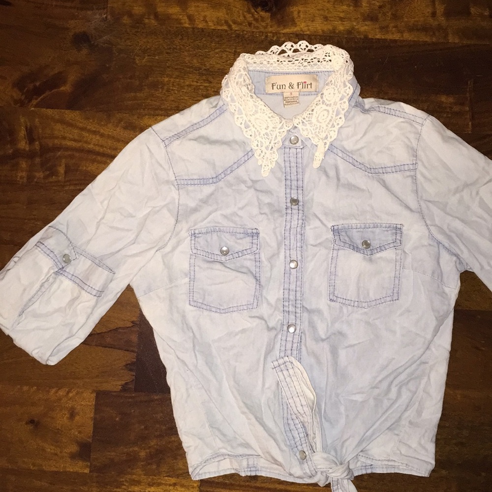 Denim shirt with a lace collar and tie